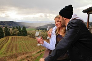 Couple drinking wine in Oregon at Youngberg Hill.