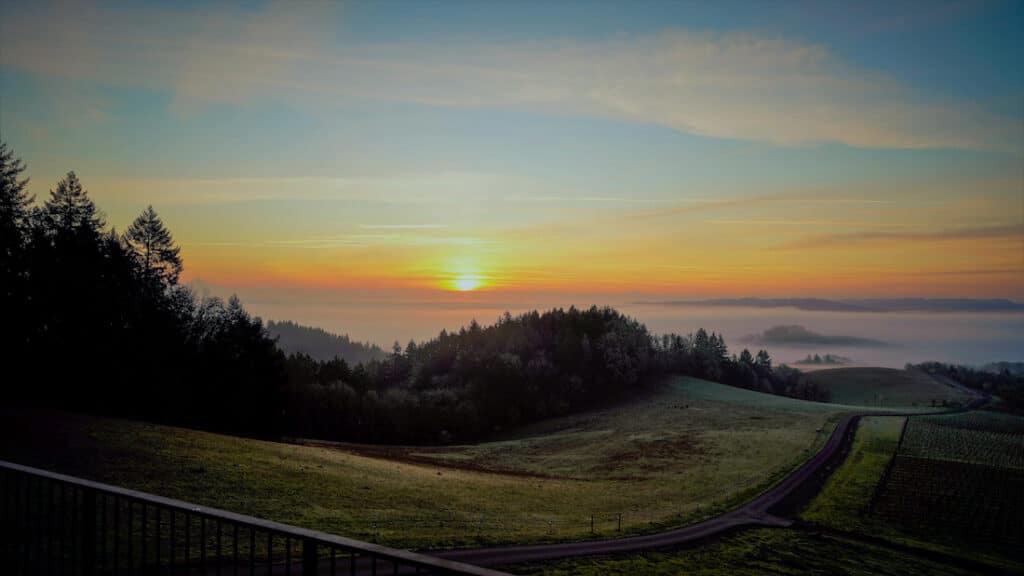 Things to do in McMinnville, image of a beautiful sunset from the deck of our Willamette Valley Bed and Breakfast