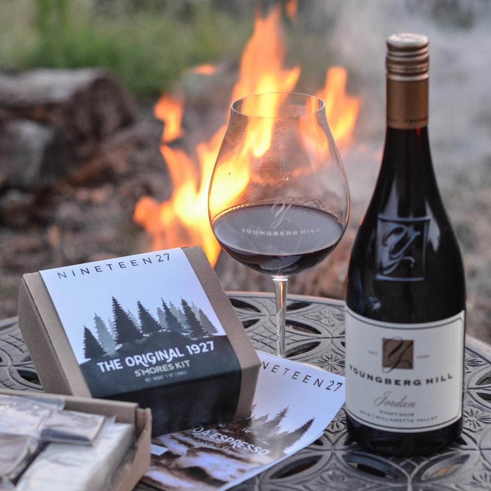 Bottle of the best Willamette Valley Pinot Noir by a fire with S'mores